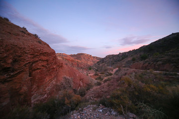 Obraz premium red rocks canyon with red and blue sunset 