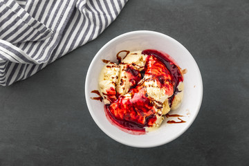 delicious vanilla ice cream with raspberry sauce