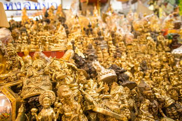 store with super colorful and well-lit Buddha statues