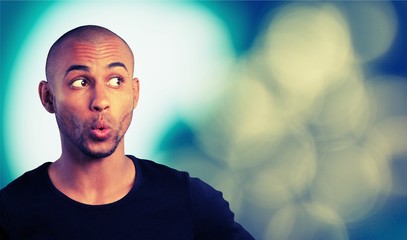 Portrait of handsome young man with facial expression on