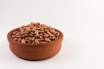 A plate of beans on white background