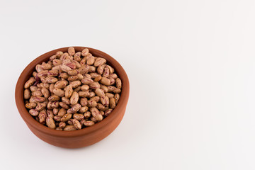 A plate of beans on white background