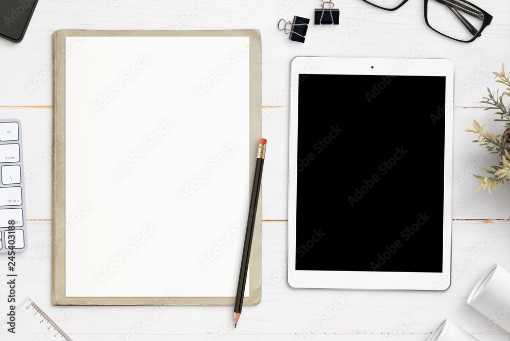 Leinwandbilder empty paper and tablet with blank screen for mockup. app or web site design and planning concept.