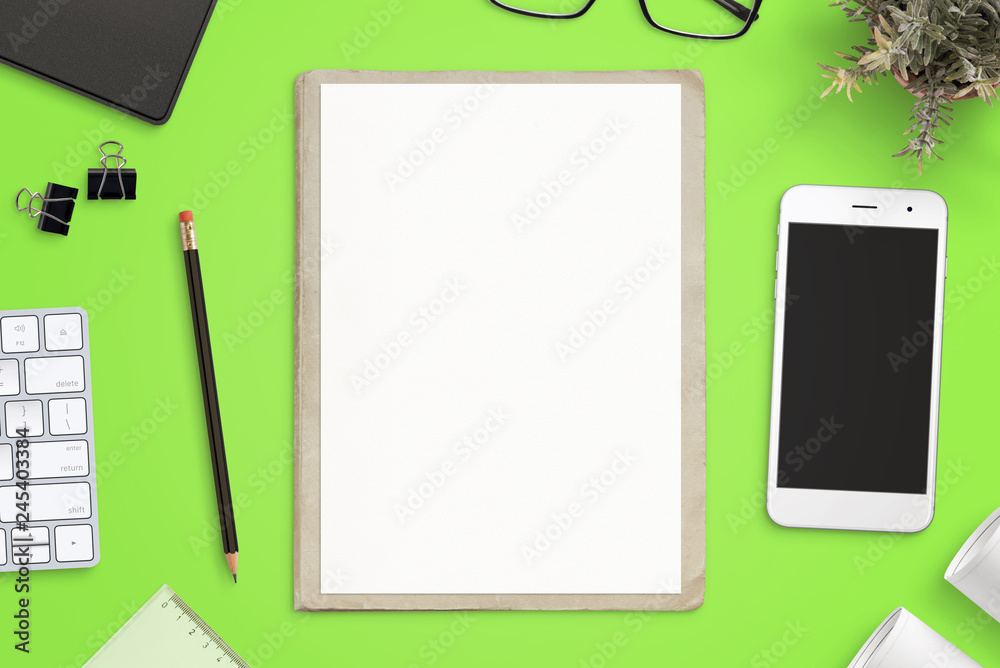Poster Work desk with empty paper on folder for sketch mockup. Smart phone mockup beside. Top view, flat lay.
