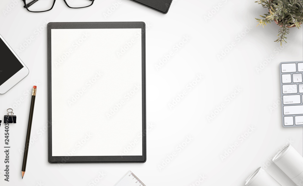 Poster blank paper and folder on office desk with copy space beside. top view, flat lay.