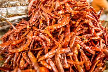 sack full of chili peppers in supermarket