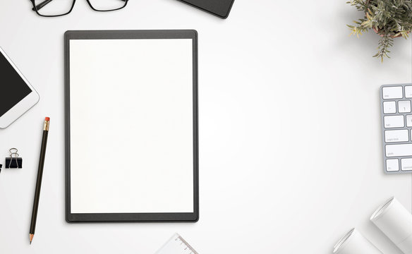 Blank Paper And Folder On Office Desk With Copy Space Beside. Top View, Flat Lay.