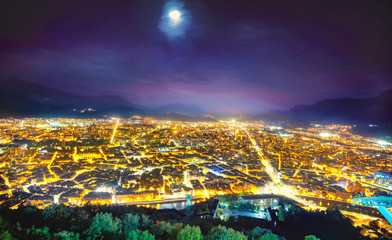 Panoramic view of Grenoble city at night. France .