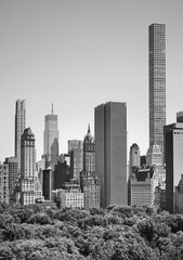 Black and white picture of New York skyscrapers by the Central Park, USA. - obrazy, fototapety, plakaty