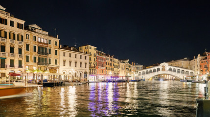 Night cityscape of Venice city colorful buildings on water