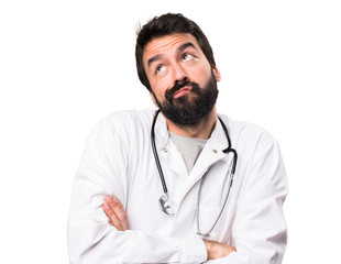 Young doctor making unimportant gesture on white background