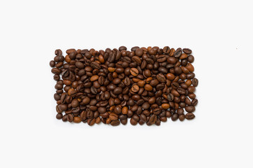 Coffee grains on a white background in the form of a rectangle.