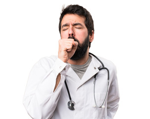 Young doctor coughing a lot on white background