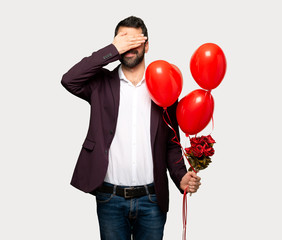 Man in valentine day covering eyes by hands. Do not want to see something over isolated grey background