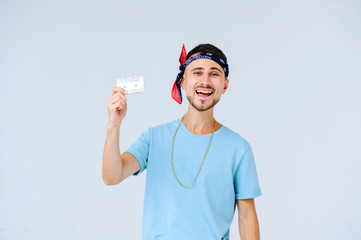 fashionable man in bright pants, a manifestation of emotions of joy, gestures with hands a place for the text