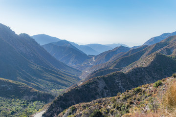 Mountain valley with winding road in California mountains