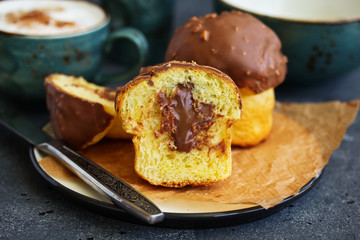 Brioche bun with chocolate filling and chocolate coating.