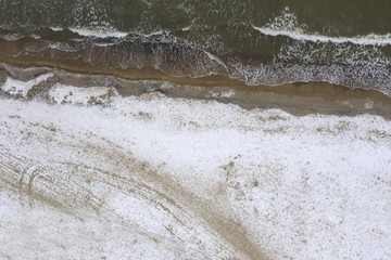 Winter sea and snow on sand 