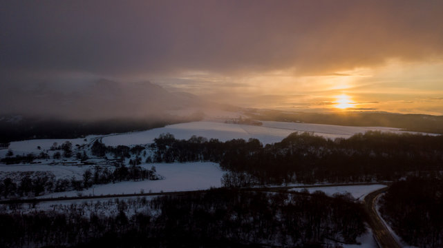 Sunset in the winter mountains landscape. Aerial view from above.