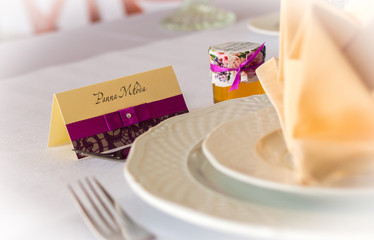 Wedding table close up with elegant visit card says "Bride" (in Polish).