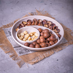 hazelnuts in bowl on wooden table