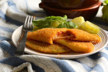 Fried panzerotti filled with tomato sauce and cheese -  Italian Food