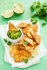corn tortilla chips with guacamole dip.