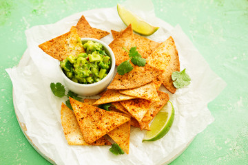 corn tortilla chips with guacamole dip.