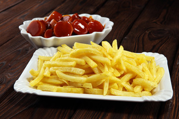 currywurst with fries. traditional german food with sausages and curry