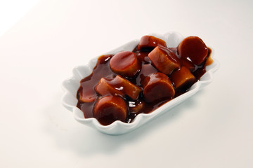 currywurst. traditional german food with sausages and curry