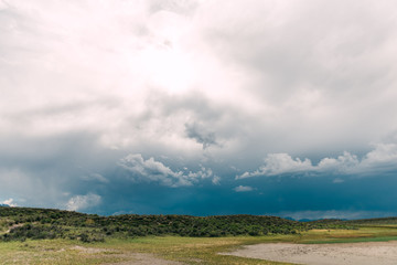 Obraz premium Dramatic clouds over dry desert endorheic lake bed