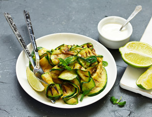 Grilled zucchini with sauce and pitta. view from above. Selective focus.