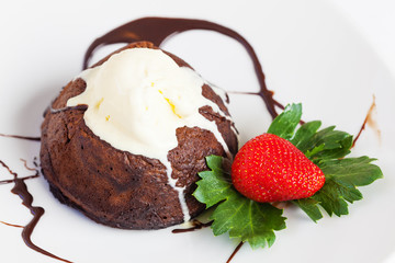 Chocolate cake with cream at the plate