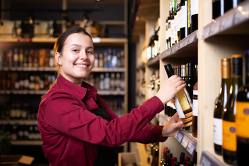 Picture on side of happy brunette seller in store