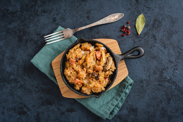 Bigos-traditional Polish dish of finely chopped sauerkraut and fresh cabbage with meat, mushrooms, and sausage. The dish is also traditional for Belarusian, Ukrainian and Lithuanian cuisine.