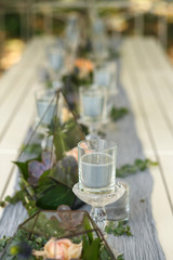 Florarium with fresh succulent and rose flowers festive table decoration. Event fresh flowers decoration. Florist workflow. Wedding ceremony  design