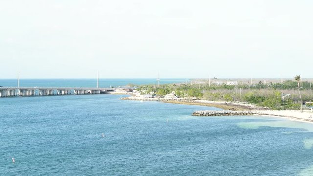 High angle aerial view of Bahia Honda Key, USA Florida state park island with coast beach after hurricane irma destruction damage in summer with water and traffic cars on overseas highway road