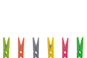 Colorful wooden clothespins on white background