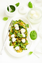 Grilled zucchini, mozzarella and pesto salad. Selective focus.