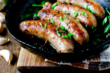 Homemade sausages from turkey (chicken) fried in a frying pan