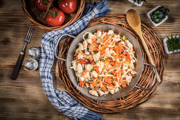 Fried chicken pieces with vegetables.