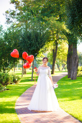 Happy bride and red ballons