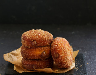 Donuts with cinnamon and chocolate cream. Homemade baking. Selective focus.