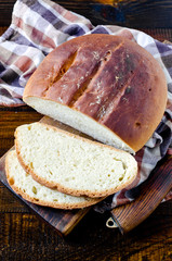 Homemade bread on a dark wooden background