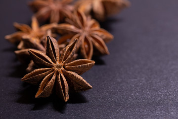 Close up of star anise seeds on grey