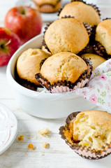 Apple muffins on a white wooden background