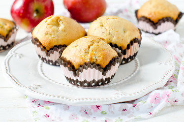 Apple muffins on a white wooden background