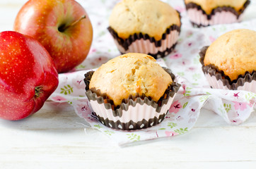 Apple muffins on a white wooden background