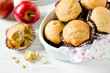 Apple muffins on a white wooden background