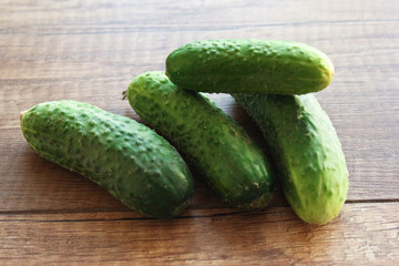 Cucumber on wooden background, vegetables